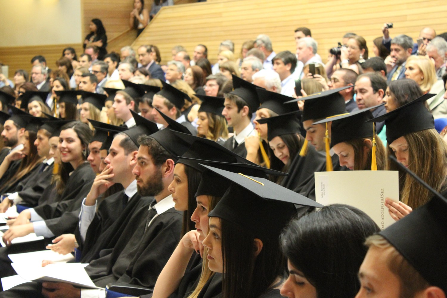 Graduates seated together at a university graduation ceremony